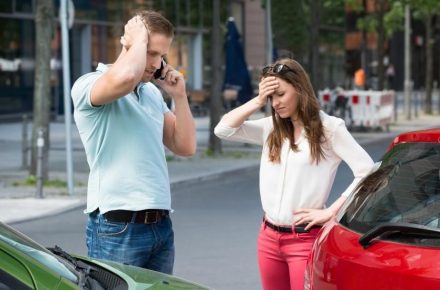 Person calling the police after car accident